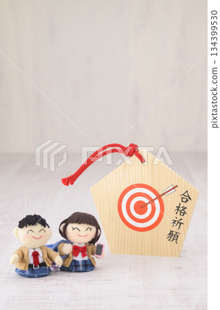 High school student dolls and votive plaques for praying for success in exams 134399530