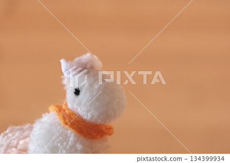 Pompom horse, white and orange scarf, diagonal left shot, open right Pompom horse, white and orange scarf, diagonal left shot, open right 134399934