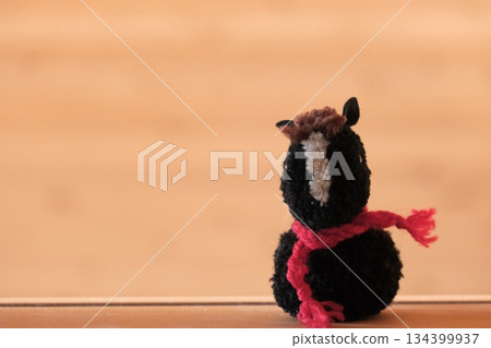 Pompom horse, black and red scarf, front view, left open Pompom horse, black and red scarf, front view, left open 134399937