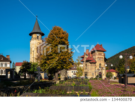 Piatra Neamt historic twin buildings under crisp blue sky Piatra Neamt historic twin buildings under crisp blue sky 134400870