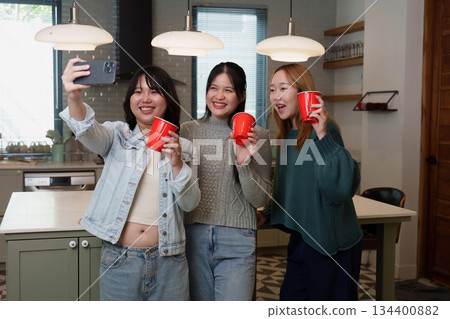 Friends taking a selfie at a party with red cups Friends taking a selfie at a party with red cups 134400882
