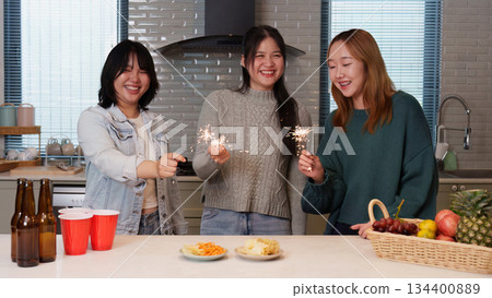 Group of friends enjoying a festive party moment Group of friends enjoying a festive party moment 134400889