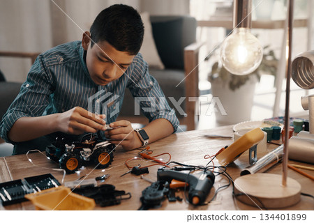 Learning, car robot and kid in home with homework, homeschool and science for tech project. Robotics, building and boy child with electrical knowledge, engineering education and studying in house. Learning, car robot and kid in home with homework, homeschool and science for tech project. Robotics, building and boy child with electrical knowledge, engineering education and studying in house. 134401899