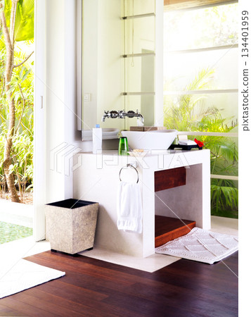 Empty room, sink and mirror in bathroom with interior design for luxury, villa and furniture with nobody. Airbnb, hotel and hospitality with washroom of resort for real estate, architecture and spa Empty room, sink and mirror in bathroom with interior design for luxury, villa and furniture with nobody. Airbnb, hotel and hospitality with washroom of resort for real estate, architecture and spa 134401959