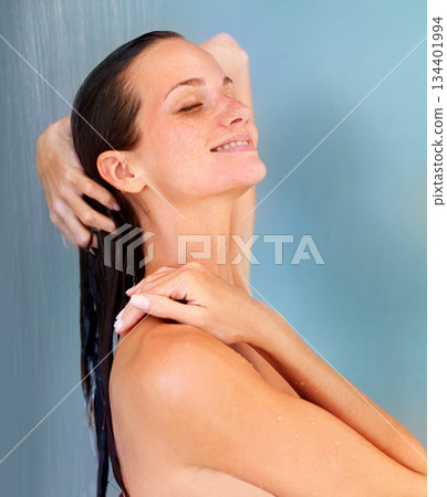 Beauty, smile and skincare with woman in shower for bathroom, hygiene and grooming. Wellness, spa and dermatology with face of girl for washing hair, cleaning or hydration isolated on blue background Beauty, smile and skincare with woman in shower for bathroom, hygiene and grooming. Wellness, spa and dermatology with face of girl for washing hair, cleaning or hydration isolated on blue background 134401994