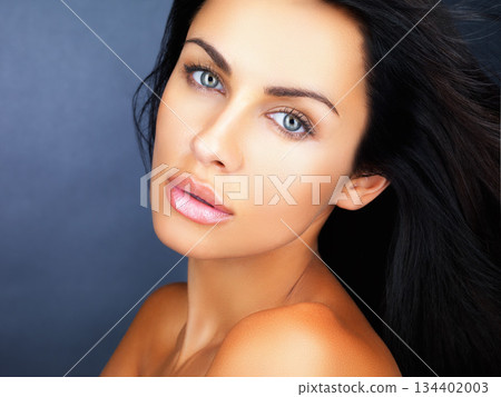 Portrait, beauty and woman with skincare, cosmetics and dermatology on blue studio background. Face, person and model with makeup, shine or glow with healthy skin, wellness and aesthetic with luxury Portrait, beauty and woman with skincare, cosmetics and dermatology on blue studio background. Face, person and model with makeup, shine or glow with healthy skin, wellness and aesthetic with luxury 134402003