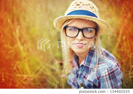 Lens flare, countryside and portrait of woman in field for freedom, wellness and fresh air outdoors. Nature, summer and face of hipster female person in meadow for relaxing, calm and peace in morning Lens flare, countryside and portrait of woman in field for freedom, wellness and fresh air outdoors. Nature, summer and face of hipster female person in meadow for relaxing, calm and peace in morning 134402035
