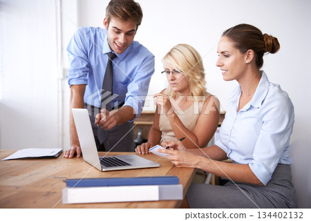 Business people, discussion and teamwork on laptop in office for online project, brainstorming and decision making. Group of employees, computer and collaboration for strategy, analysis and planning 134402132