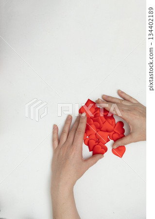 Hands Sorting Red Hearts for Valentine's Day Digital Content Creation Hands Sorting Red Hearts for Valentine's Day Digital Content Creation 134402189