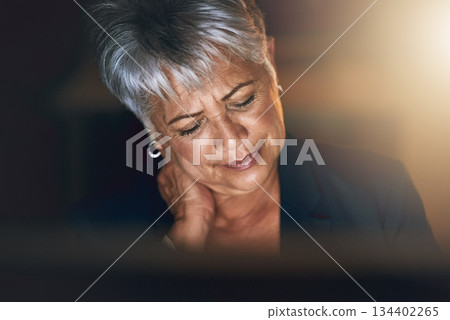 Stress, night and businesswoman with neck pain in the office to complete a deadline project. Sick, back or shoulder problem and mature professional female employee working overtime in the workplace. Stress, night and businesswoman with neck pain in the office to complete a deadline project. Sick, back or shoulder problem and mature professional female employee working overtime in the workplace. 134402265
