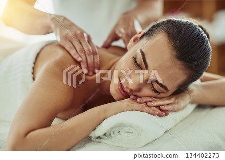 Relax, peace and massage with woman in spa for wellness, luxury and back pain treatment. Skincare, beauty and zen with female customer and hands of therapist for physical therapy, salon and detox 134402273