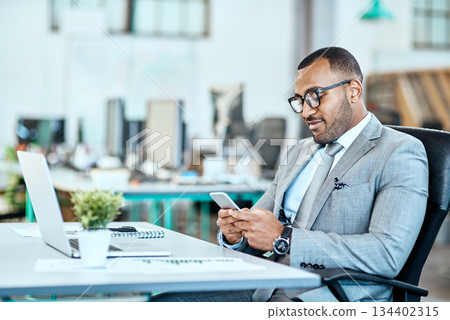Phone, typing and business man in office communication, networking and reading social media or job email. Cellphone, connection or online search of happy african person on mobile app or startup chat 134402315
