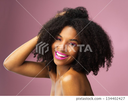 Hair care, face and smile of black woman with afro in studio isolated on pink background. Hairstyle portrait, makeup cosmetics and funny African female model with salon treatment for beauty lipstick. 134402427