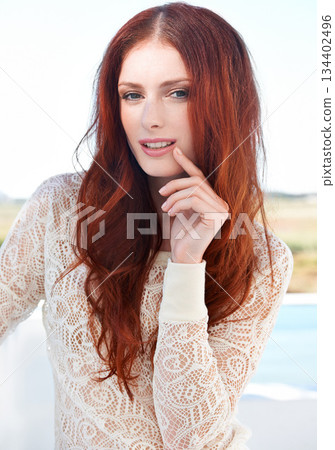 Redhead, beauty and woman fashion portrait outdoor with ginger hairstyle and treatment. Hair care, female person youth and young model with confidence and beautiful hairstylist haircut outside alone 134402496
