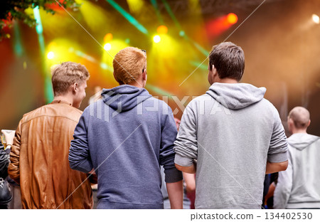 Music, friends and party with men at festival for celebration, rave culture and performance. Carnival, summer and techno with audience at concert for laser light show, energy and dj event 134402530