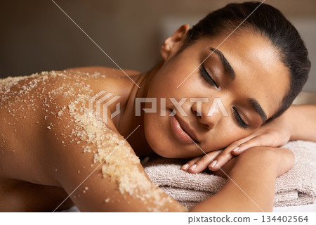 Eyes closed, body scrub or back massage for woman to relax for resting or wellness physical therapy in spa. Girl client sleeping in beauty salon to exfoliate for a healthy skincare healing treatment Eyes closed, body scrub or back massage for woman to relax for resting or wellness physical therapy in spa. Girl client sleeping in beauty salon to exfoliate for a healthy skincare healing treatment 134402564