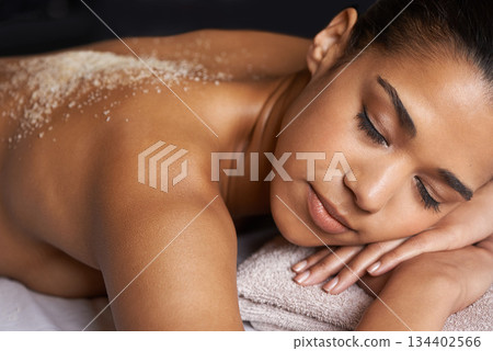 Girl sleeping, body scrub or back massage to relax for zen resting or wellness physical therapy in spa. Relaxed female client in salon to exfoliate for luxury skincare treatment or beauty therapy 134402566