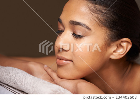 Woman, eyes closed or massage in hotel to relax for zen resting or wellness physical therapy in luxury spa. Face of girl sleeping in salon resort for body healing treatment or natural holistic detox 134402608