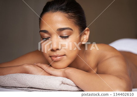 Woman, eyes closed or massage in hotel to relax for zen resting or wellness physical therapy in luxury resort. Face of girl sleeping in salon for body healing treatment or natural holistic detox 134402610