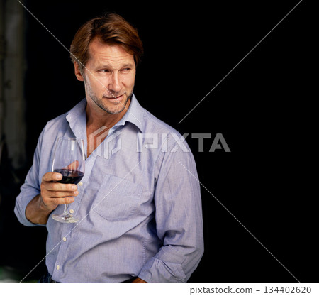 Wine, mockup and thinking with a man in the distillery of a farm for the production or fermentation of alcohol. Glass, industry and dark with a male farmer drinking a beverage for quality control 134402620