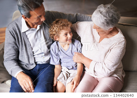 Boy, relax or happy grandparents with a child talking, laughing or hugging with love in family home. Elderly grandma, old man or kid relaxing, bonding or enjoying quality time together in retirement Boy, relax or happy grandparents with a child talking, laughing or hugging with love in family home. Elderly grandma, old man or kid relaxing, bonding or enjoying quality time together in retirement 134402640