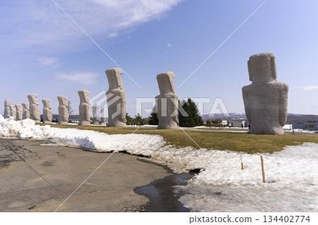 Moai, big stone statue in winter with snow on ground at hill of Buddha in Sapporo, Makomanai takino 134402774