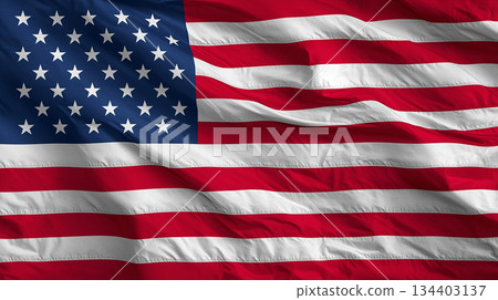 American Flag Flown On Tall Flagpole Against Clear Blue Sky, Symbol Of Freedom And Patriotism American Flag Flown On Tall Flagpole Against Clear Blue Sky, Symbol Of Freedom And Patriotism 134403137