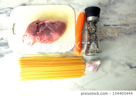 Layout of products cooking pasta with minced meat view from above. 134403444