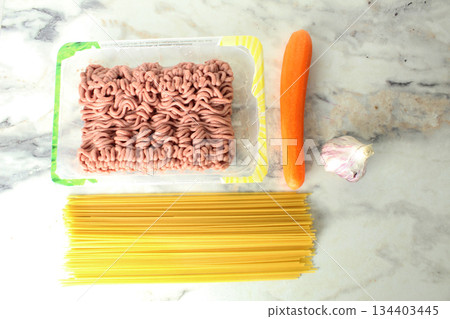 Recipe concept for pasta bolognese spaghetti vegetables meat minced meat top view. 134403445