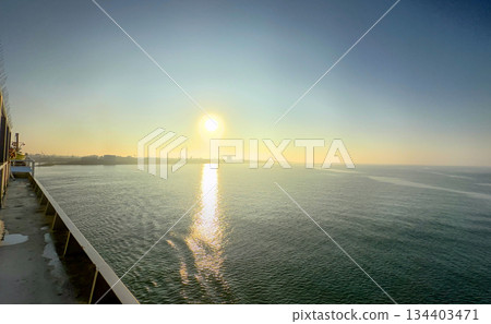 Experience the Tranquil Sunrise Over Serene Waters and bask in the beauty of natures calm Experience the Tranquil Sunrise Over Serene Waters and bask in the beauty of natures calm 134403471