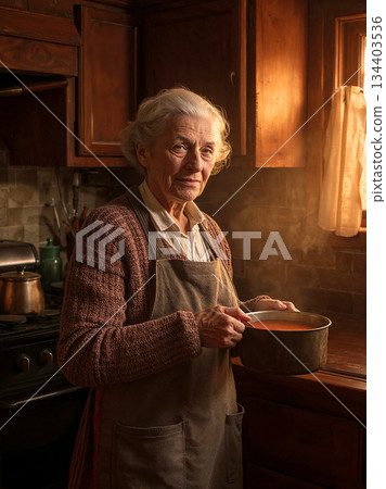 Portrait of senior grandmother holding pot of hot soup in rustic kitchen. Elderly woman cooking homemade meal with steam rising. Warm family atmosphere. 134403536