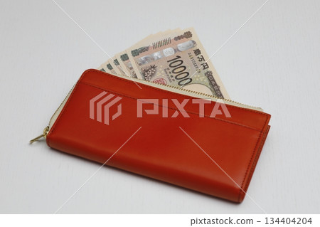 Brown wallet and 10,000 yen bills 134404204
