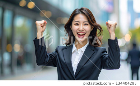 Businesswoman pumping her fist (AI-generated image) 134404293