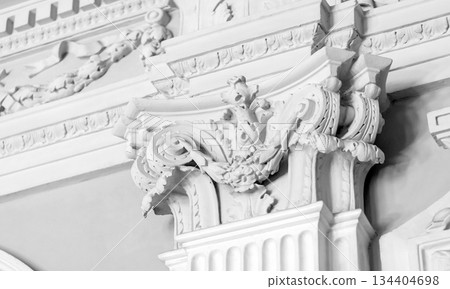 Intricately designed baroque ornamentation carving on a white wall Intricately designed baroque ornamentation carving on a white wall 134404698