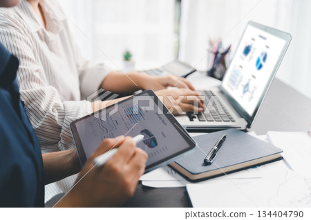 Business meeting, data analytics or women with graph presentation in office. Chart, analysis accounting team brainstorming economy, inflation or solution. business project finance investment concept. 134404790