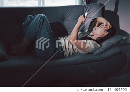 Sorrowful woman sat alone, overwhelmed by emotion, her sad and unhappy expression revealing deep despair, stress and distress left feeling depressed. sorrowful sad, despair alone, depressed stress Sorrowful woman sat alone, overwhelmed by emotion, her sad and unhappy expression revealing deep despair, stress and distress left feeling depressed. sorrowful sad, despair alone, depressed stress 134404793