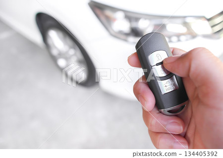 Hand Using Car Key Fob for Lock or Unlock Hand Using Car Key Fob for Lock or Unlock 134405392