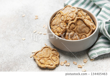 Homemade paw print dog treats with oats Homemade paw print dog treats with oats 134405463