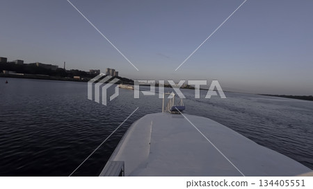 River cruise ship sailing towards sunset bridge. Clip 134405551