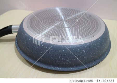 Close-up of the bottom of a non-stick frying pan Close-up of the bottom of a non-stick frying pan 134405781