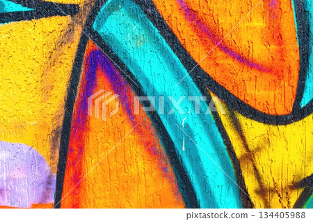 Colorful Abstract Graffiti Texture with Bold Orange, Blue, Purple for Modern Urban Art 134405988