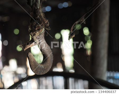 Rusty hook old rope decay texture rustic detail metal curve moody light shallow focus abandoned interior evokes mystery mood Rusty hook old rope decay texture rustic detail metal curve moody light shallow focus abandoned interior evokes mystery mood 134406837