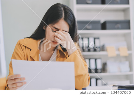 Headache, business woman at night and computer stress while working for a deadline with pc glitch. Sad corporate manager with anxiety about target working at desk screen late to complete task online 134407060