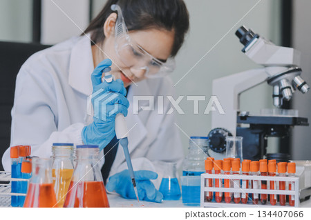 Portrait, science and happy woman on laptop in lab to research chemistry, test or innovation. Microscope, scientist and face of medical doctor in goggles for microbiology, healthcare or pharma study Portrait, science and happy woman on laptop in lab to research chemistry, test or innovation. Microscope, scientist and face of medical doctor in goggles for microbiology, healthcare or pharma study 134407066