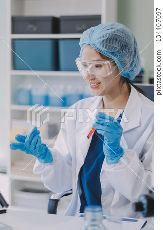 Portrait, science and happy woman on laptop in lab to research chemistry, test or innovation. Microscope, scientist and face of medical doctor in goggles for microbiology, healthcare or pharma study Portrait, science and happy woman on laptop in lab to research chemistry, test or innovation. Microscope, scientist and face of medical doctor in goggles for microbiology, healthcare or pharma study 134407097