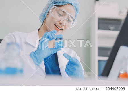 Portrait, science and happy woman on laptop in lab to research chemistry, test or innovation. Microscope, scientist and face of medical doctor in goggles for microbiology, healthcare or pharma study Portrait, science and happy woman on laptop in lab to research chemistry, test or innovation. Microscope, scientist and face of medical doctor in goggles for microbiology, healthcare or pharma study 134407099