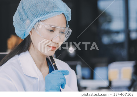 Portrait, science and happy woman on laptop in lab to research chemistry, test or innovation. Microscope, scientist and face of medical doctor in goggles for microbiology, healthcare or pharma study Portrait, science and happy woman on laptop in lab to research chemistry, test or innovation. Microscope, scientist and face of medical doctor in goggles for microbiology, healthcare or pharma study 134407102
