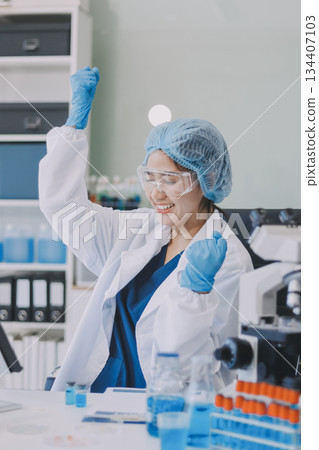 Portrait, science and happy woman on laptop in lab to research chemistry, test or innovation. Microscope, scientist and face of medical doctor in goggles for microbiology, healthcare or pharma study Portrait, science and happy woman on laptop in lab to research chemistry, test or innovation. Microscope, scientist and face of medical doctor in goggles for microbiology, healthcare or pharma study 134407103