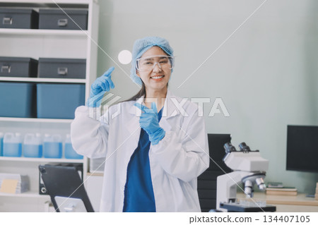 Portrait, science and happy woman on laptop in lab to research chemistry, test or innovation. Microscope, scientist and face of medical doctor in goggles for microbiology, healthcare or pharma study Portrait, science and happy woman on laptop in lab to research chemistry, test or innovation. Microscope, scientist and face of medical doctor in goggles for microbiology, healthcare or pharma study 134407105