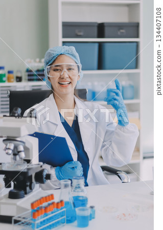 Portrait, science and happy woman on laptop in lab to research chemistry, test or innovation. Microscope, scientist and face of medical doctor in goggles for microbiology, healthcare or pharma study Portrait, science and happy woman on laptop in lab to research chemistry, test or innovation. Microscope, scientist and face of medical doctor in goggles for microbiology, healthcare or pharma study 134407108